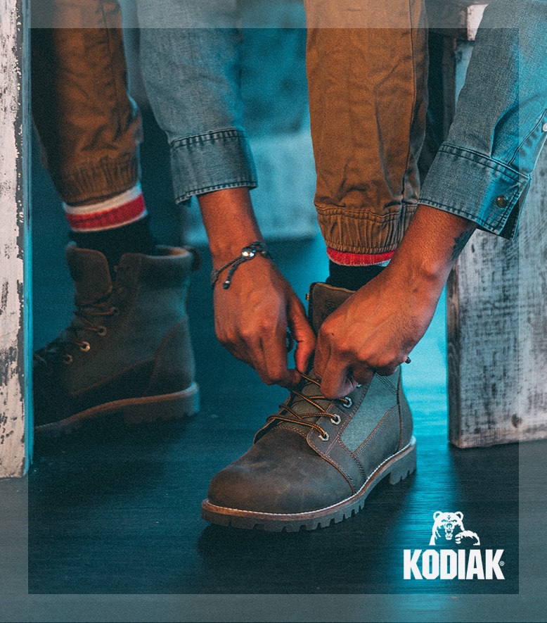 Kodiak - Man putting boots